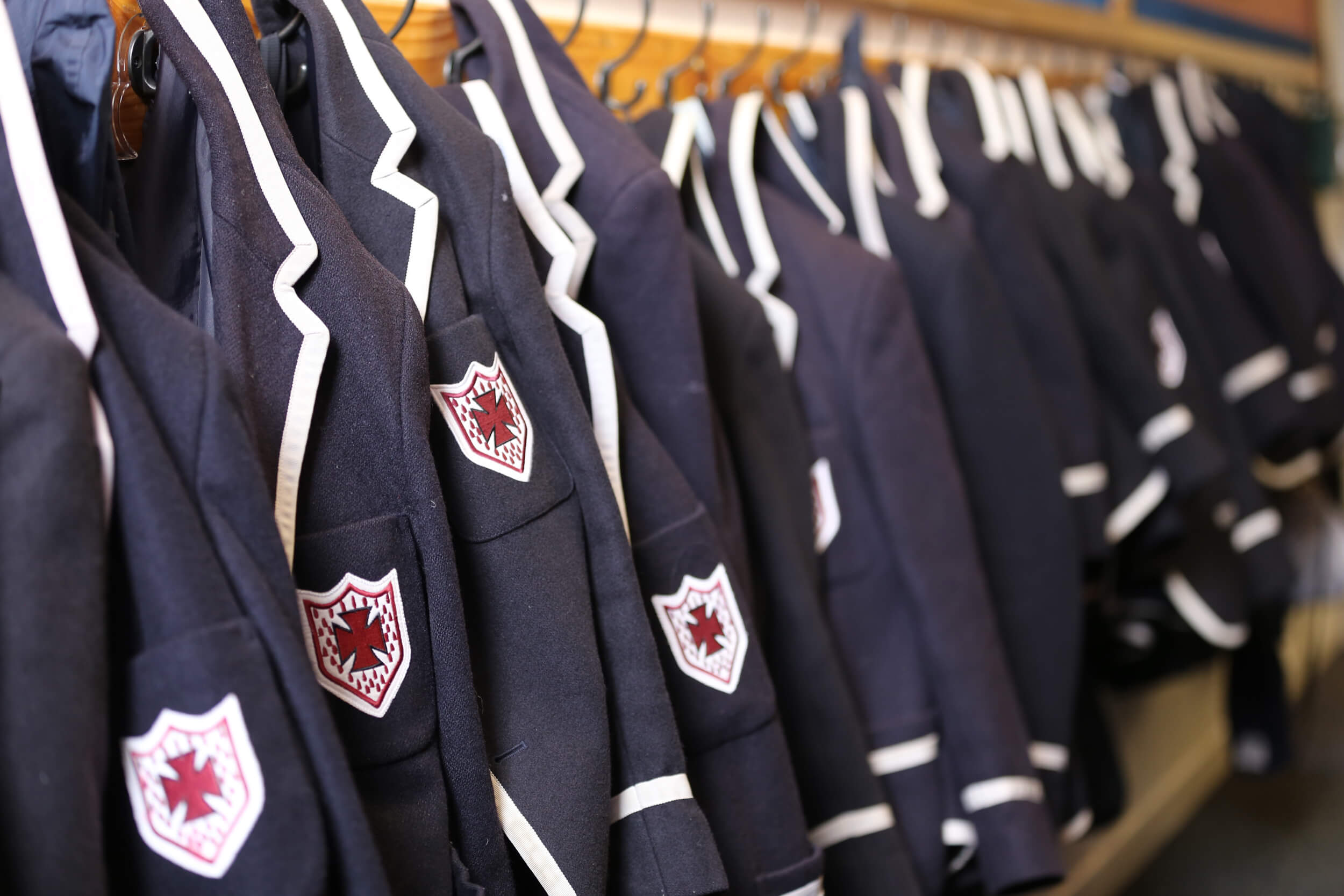 blazers hanging on pegs